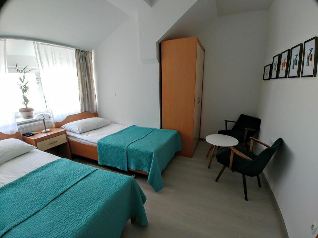 Postel nebo postele na pokoji v ubytování Hotel garni Paleta