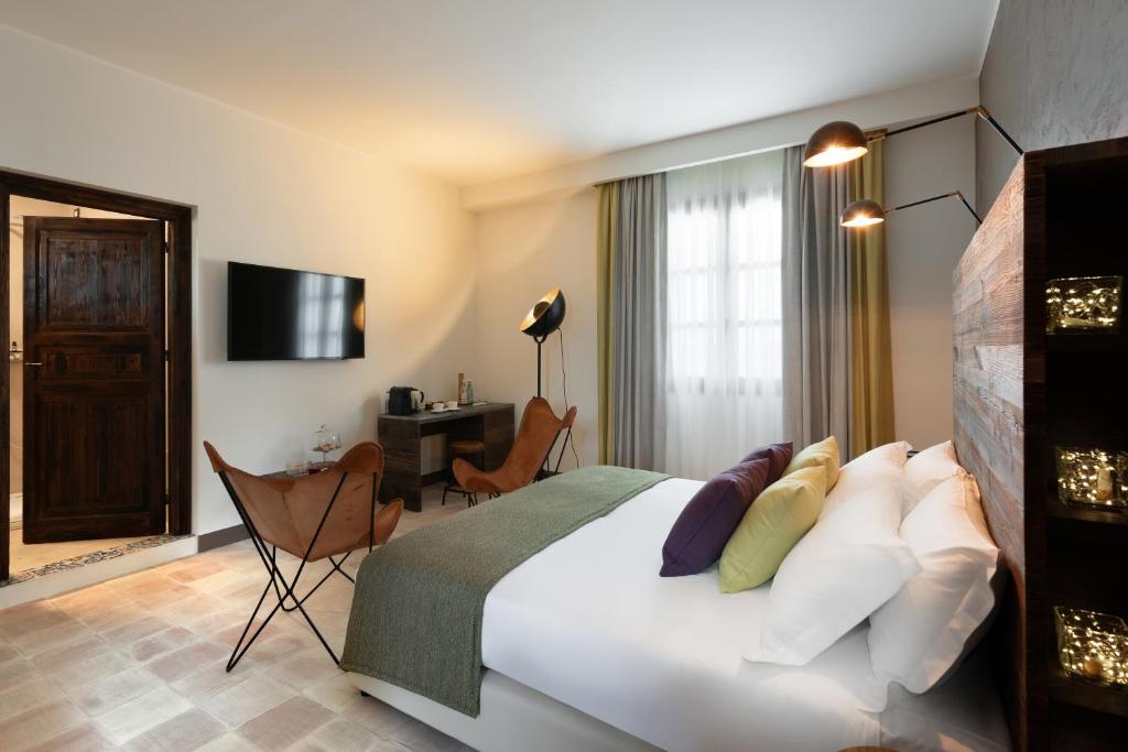 A bed or beds in a room at Momentum Wellness Bioresort