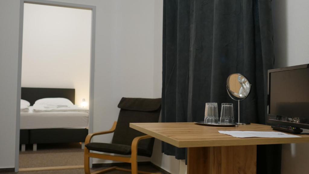 Postel nebo postele na pokoji v ubytování Hotel Bílý Koníček