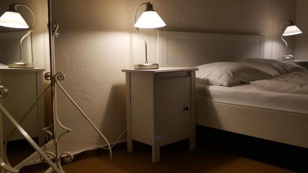 Postel nebo postele na pokoji v ubytování Hotel Bílý Koníček