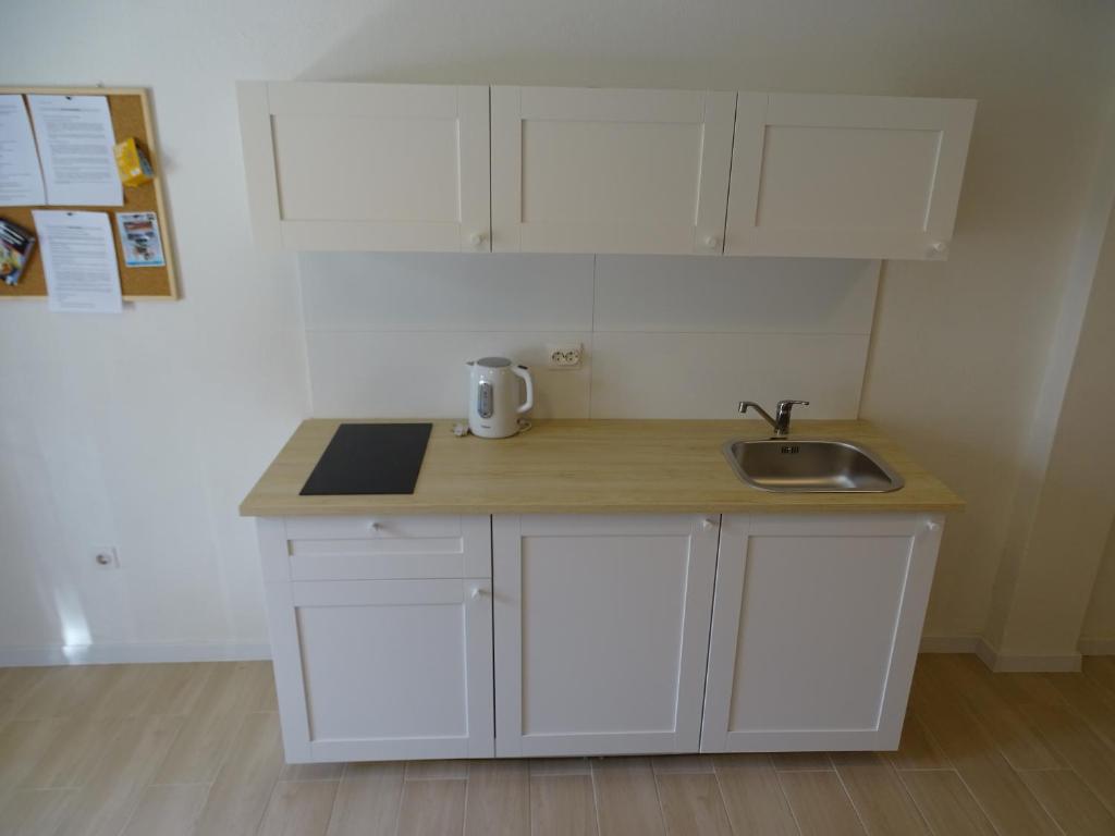 Kuchyňa alebo kuchynka v ubytovaní Job studio apartments