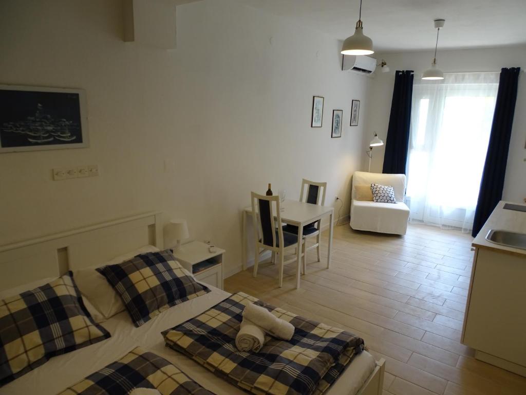 Posteľ alebo postele v izbe v ubytovaní Job studio apartments
