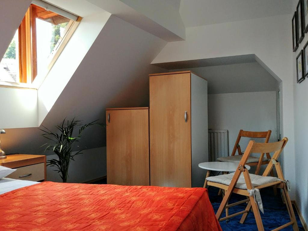 Postel nebo postele na pokoji v ubytování Hotel garni Paleta