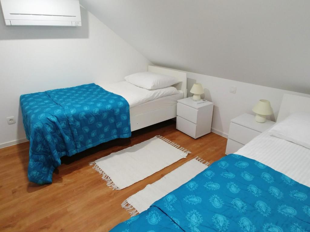 Postel nebo postele na pokoji v ubytování Hotel garni Paleta