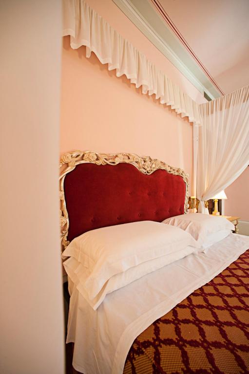 Postel nebo postele na pokoji v ubytování Albergo La Lanterna