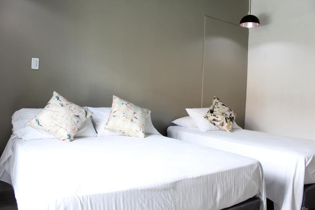 Postel nebo postele na pokoji v ubytování Hotel Boutique Plaza