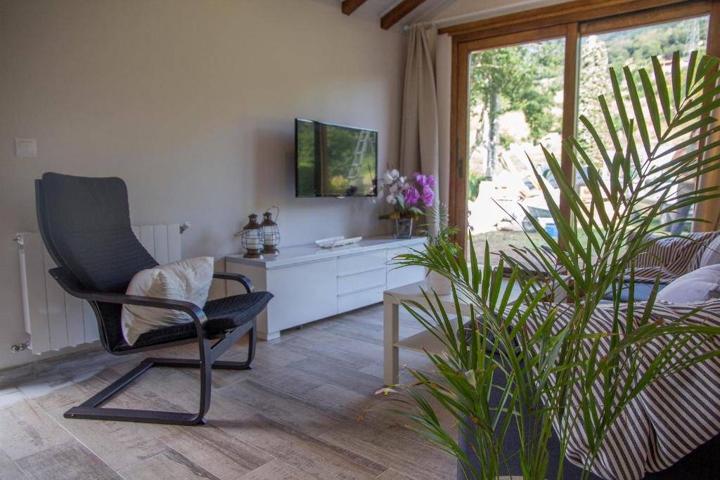 A television and/or entertainment centre at Excepcional Apartamento El Olivo