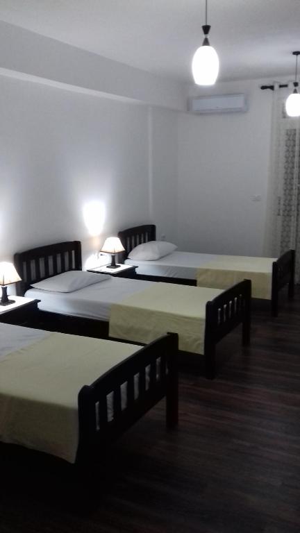 Postel nebo postele na pokoji v ubytování Vladimir Estate Hotel