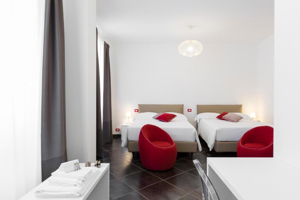 Postel nebo postele na pokoji v ubytování Interamnia Boutique Hotel