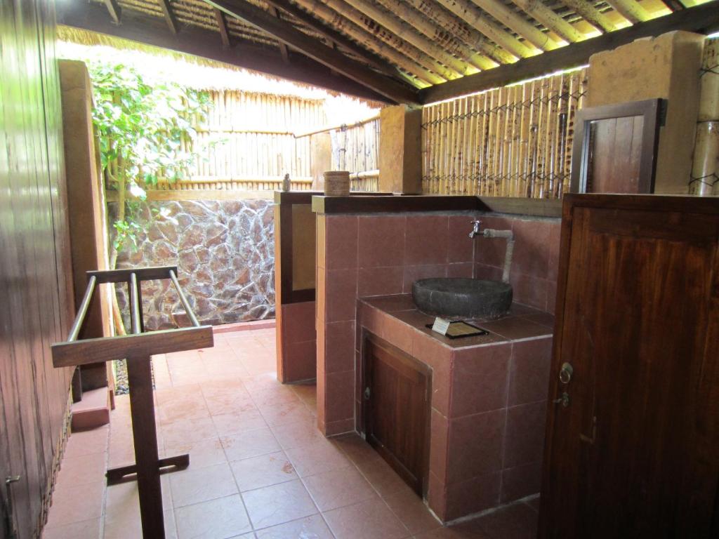 Kuchyň nebo kuchyňský kout v ubytování Gili Hideaway
