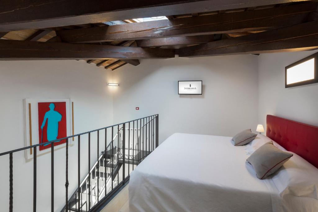Postel nebo postele na pokoji v ubytování Interamnia Boutique Hotel