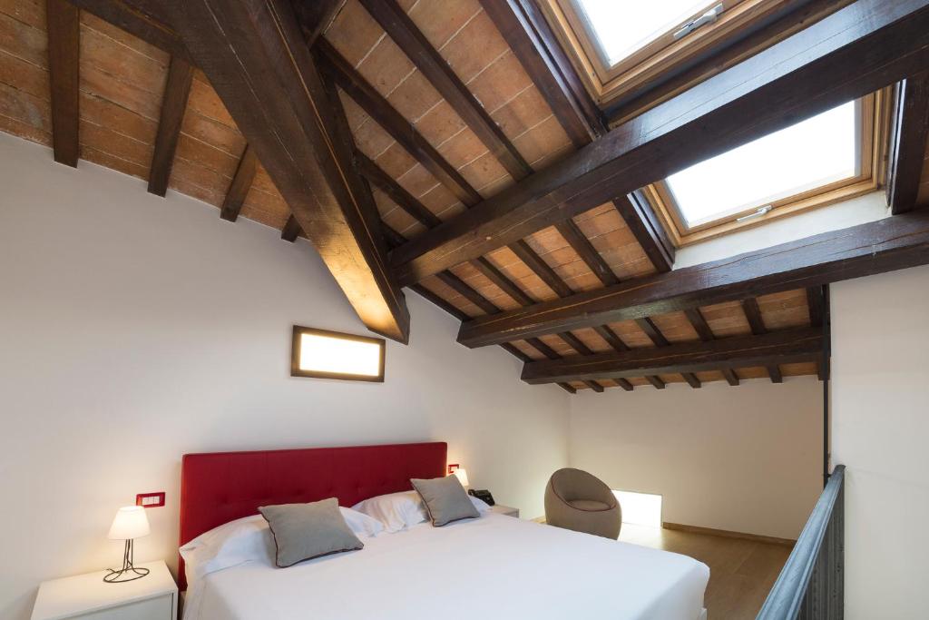 Postel nebo postele na pokoji v ubytování Interamnia Boutique Hotel