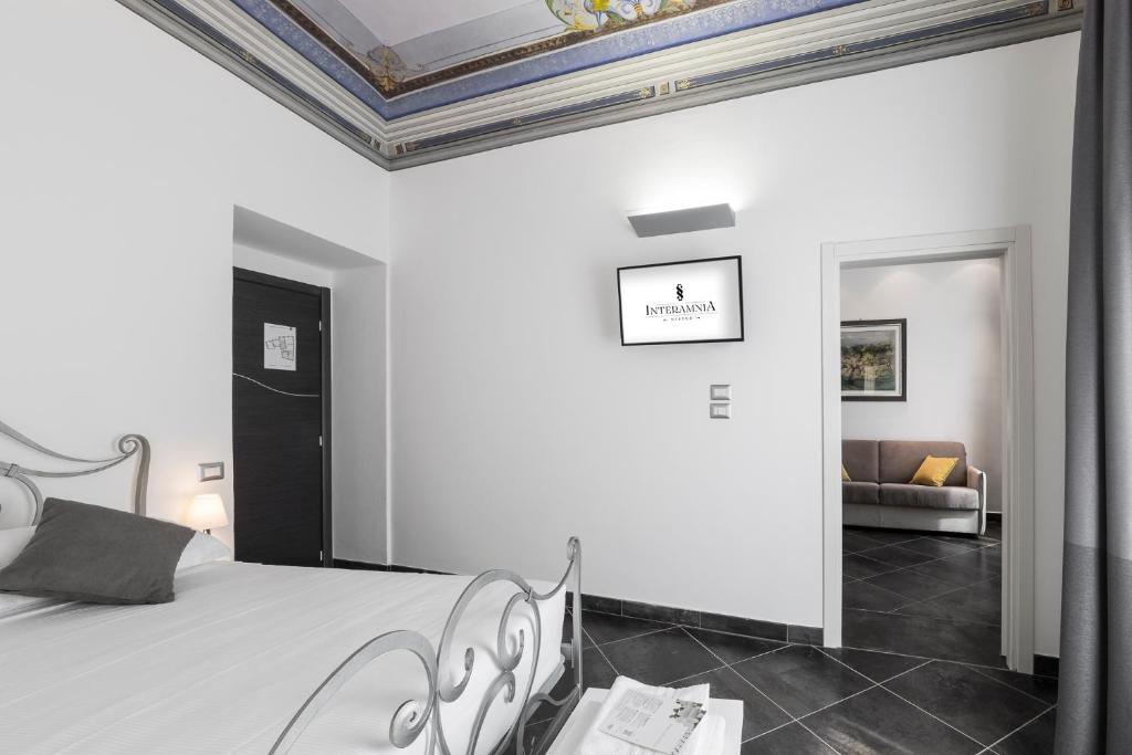 Postel nebo postele na pokoji v ubytování Interamnia Boutique Hotel