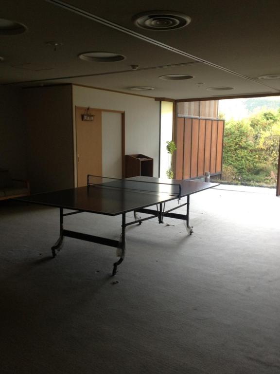 a ping pong table in the middle of a room at Lalaca in Hakone