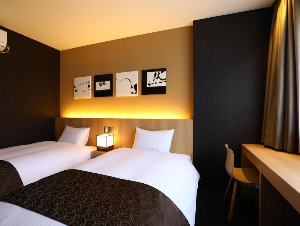 Postel nebo postele na pokoji v ubytování Hotel Wing International Kyoto - Shijo Karasuma