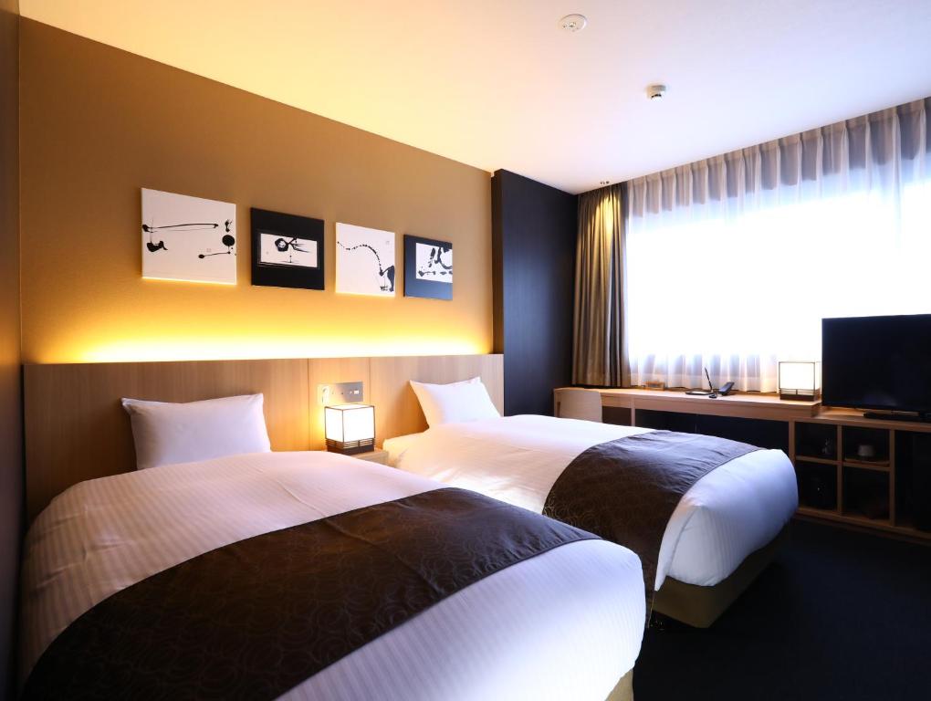 Postel nebo postele na pokoji v ubytování Hotel Wing International Kyoto - Shijo Karasuma
