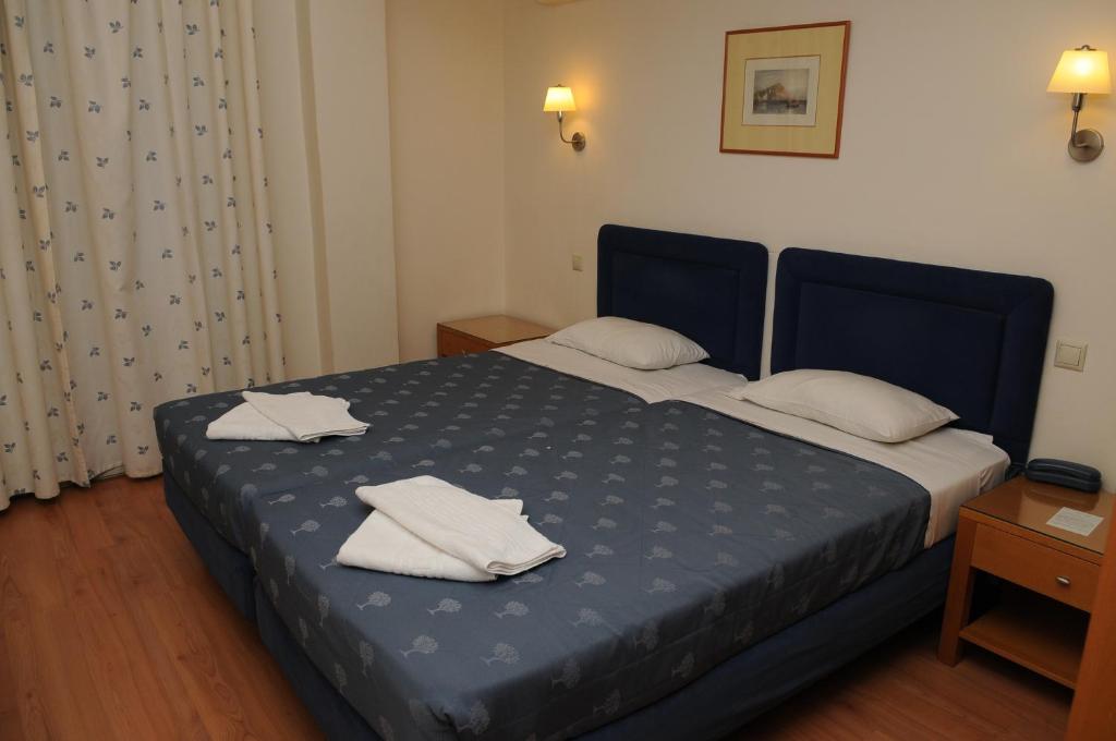 Posteľ alebo postele v izbe v ubytovaní Hotel Pantheon