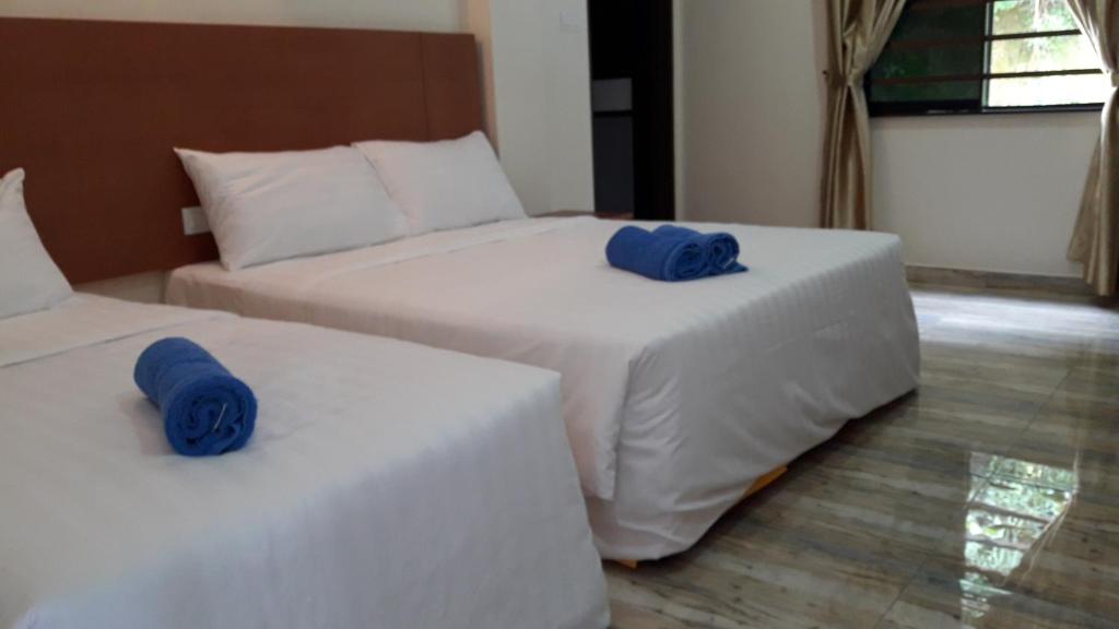 Postel nebo postele na pokoji v ubytování TULIP HOTEL & APARTMENT