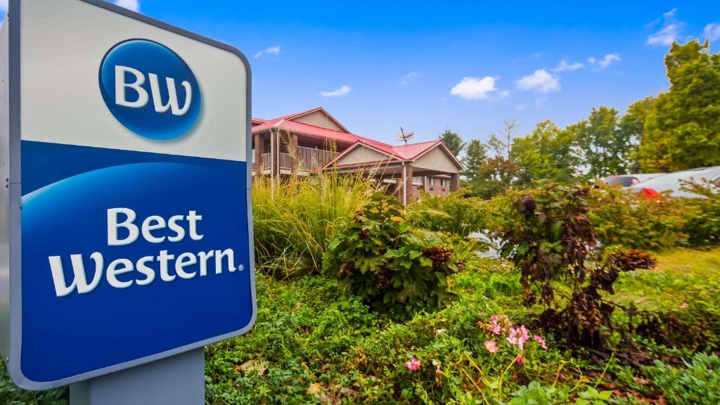 a blue and white sign for a bus best western at Best Western Paris Inn in Paris