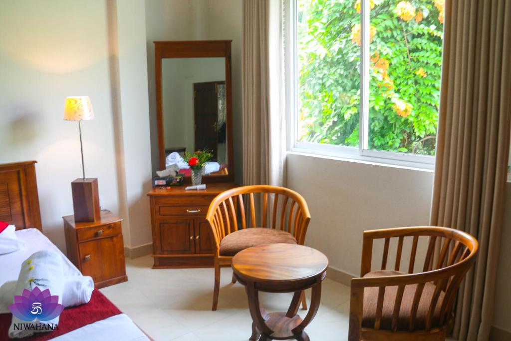 Posezení v ubytování Nivahana Homestay