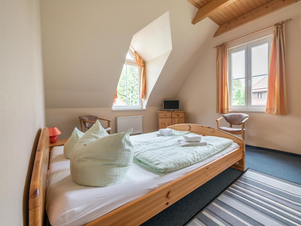 Postel nebo postele na pokoji v ubytování Appartement-Hotel-Anlage Tannenpark