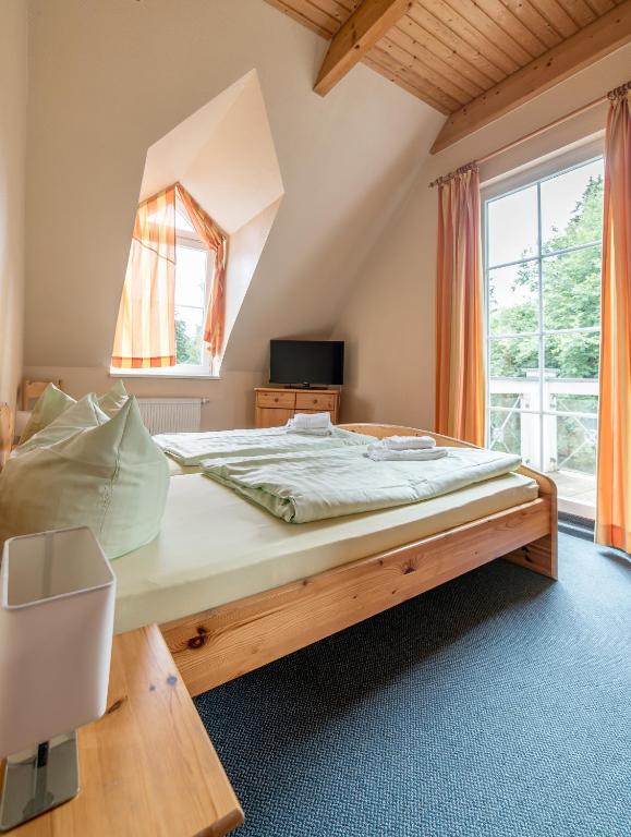 Postel nebo postele na pokoji v ubytování Appartement-Hotel-Anlage Tannenpark