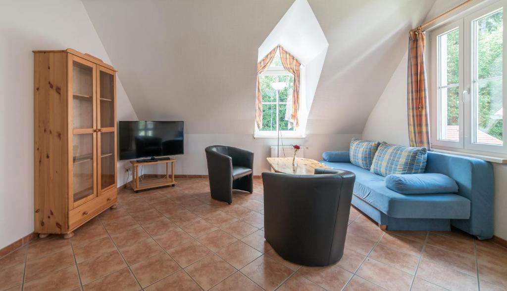 TV a/nebo společenská místnost v ubytování Appartement-Hotel-Anlage Tannenpark