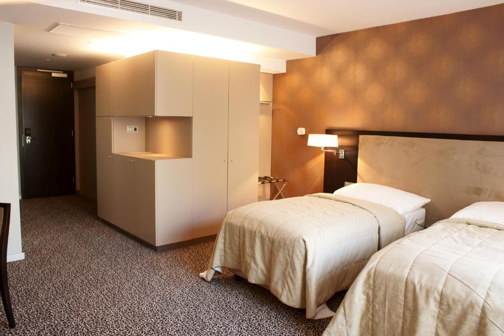 Postel nebo postele na pokoji v ubytování Hotel Avance