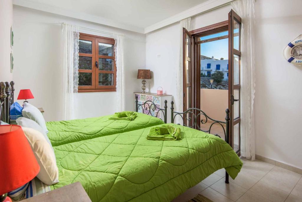 A bed or beds in a room at Lindos Emerald