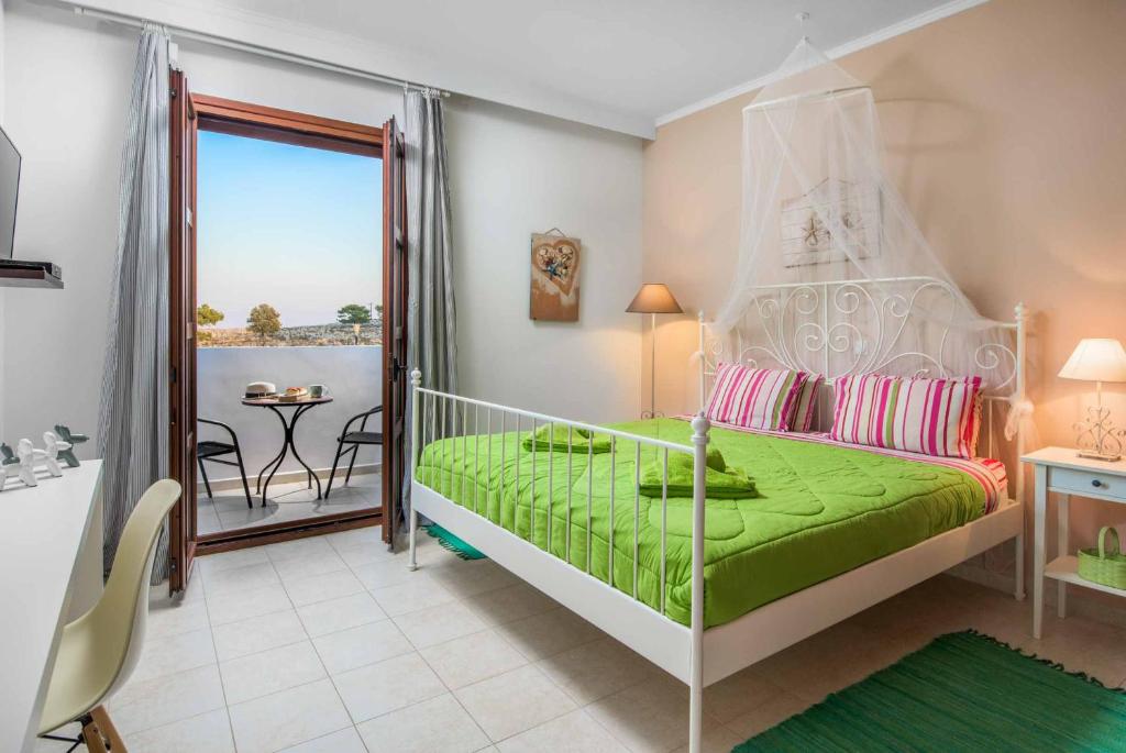 A bed or beds in a room at Lindos Emerald