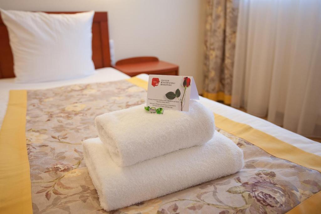 Postel nebo postele na pokoji v ubytování Hotel Rubin