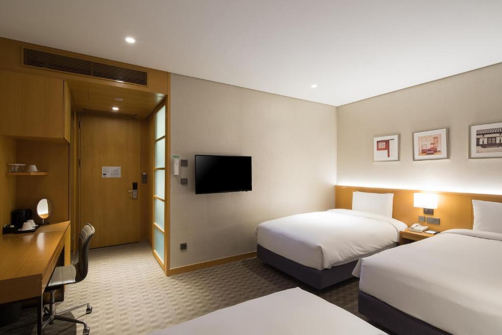 Postel nebo postele na pokoji v ubytování Sotetsu Hotels The Splaisir Seoul Dongdaemun