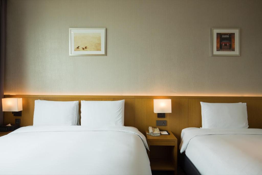 Postel nebo postele na pokoji v ubytování Sotetsu Hotels The Splaisir Seoul Dongdaemun