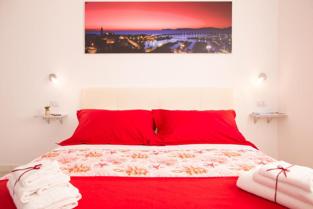 Postel nebo postele na pokoji v ubytování Rosso di Mare Alghero