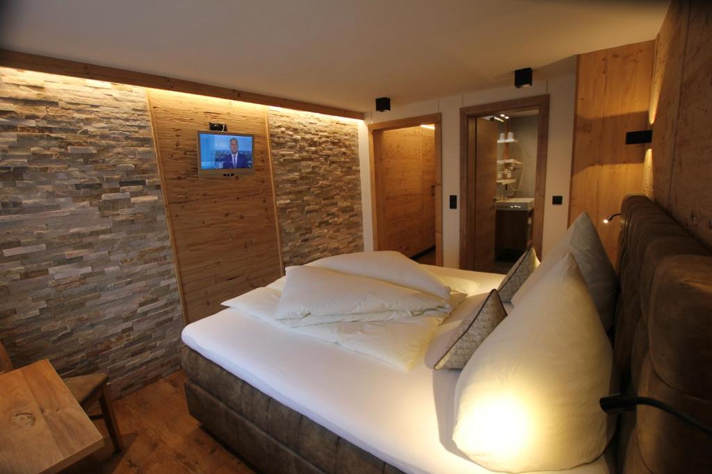 Postel nebo postele na pokoji v ubytování Hotel Maroi
