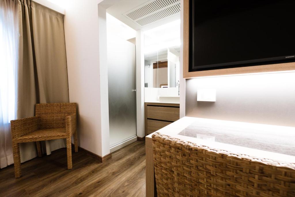 Postel nebo postele na pokoji v ubytování Hotel Corona