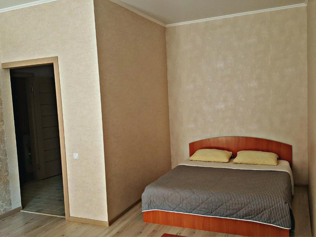 Кровать или кровати в номере "Comfort Russia" на Партизанской 55
