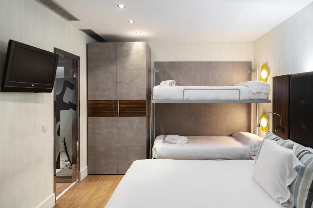 Кровать или кровати в номере Petit Palace Tamarises
