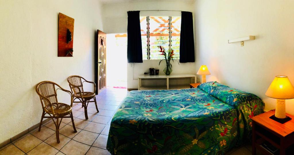 Postel nebo postele na pokoji v ubytování Hotel Santo Vanuatu