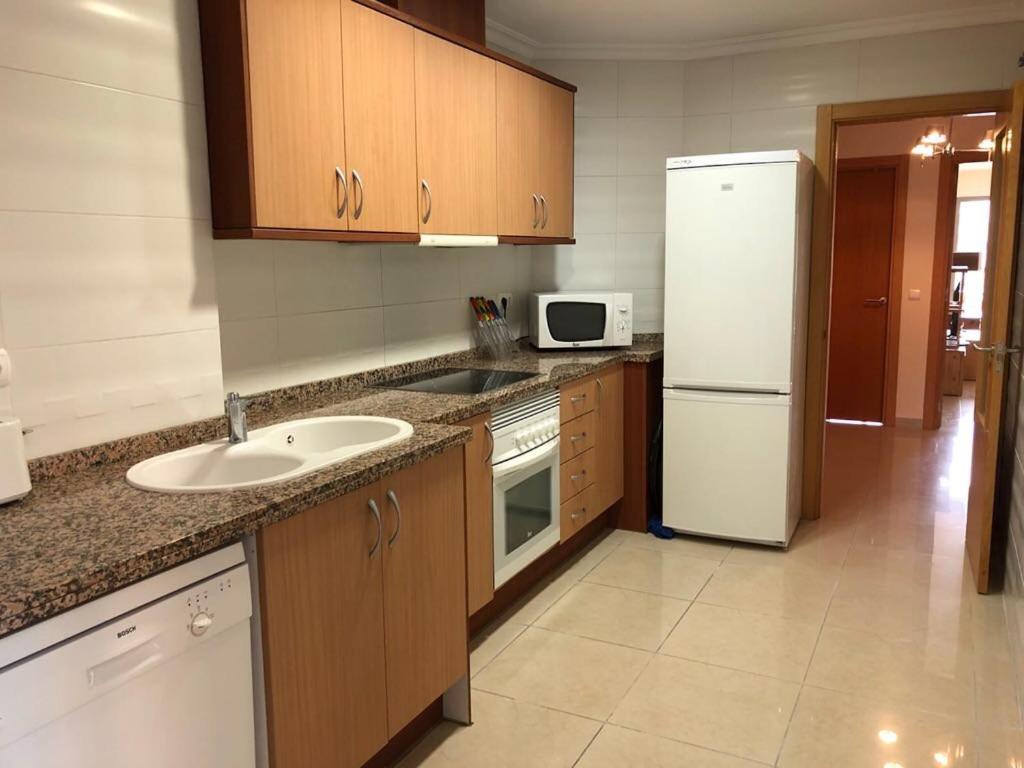Kuchyň nebo kuchyňský kout v ubytování Apartamento en la playa 96 m2