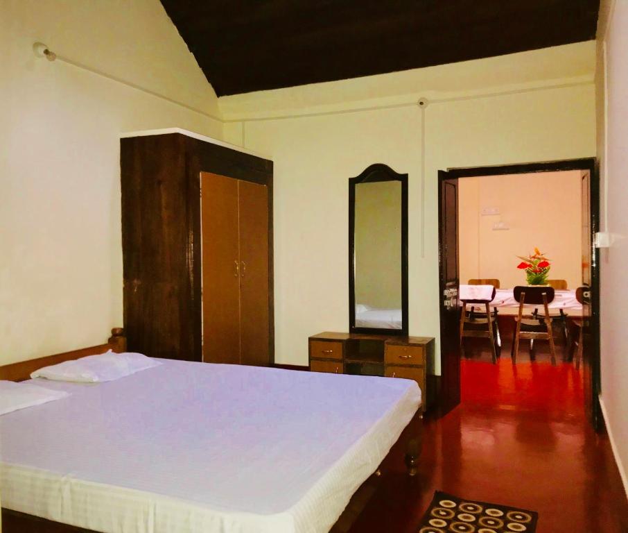 Postel nebo postele na pokoji v ubytování Shreegandha Homestay