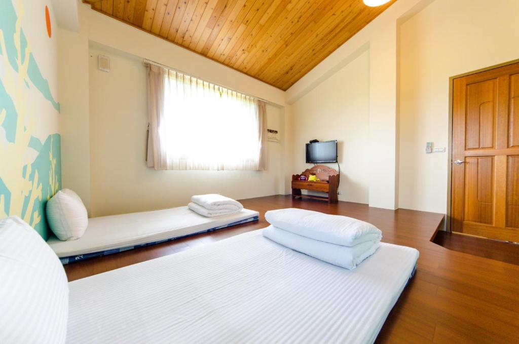 Postel nebo postele na pokoji v ubytování 雲庭民宿 Yunting B&B