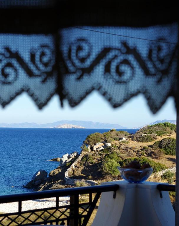 a view of the ocean from a balcony at Limnes Home in Moutsoúna