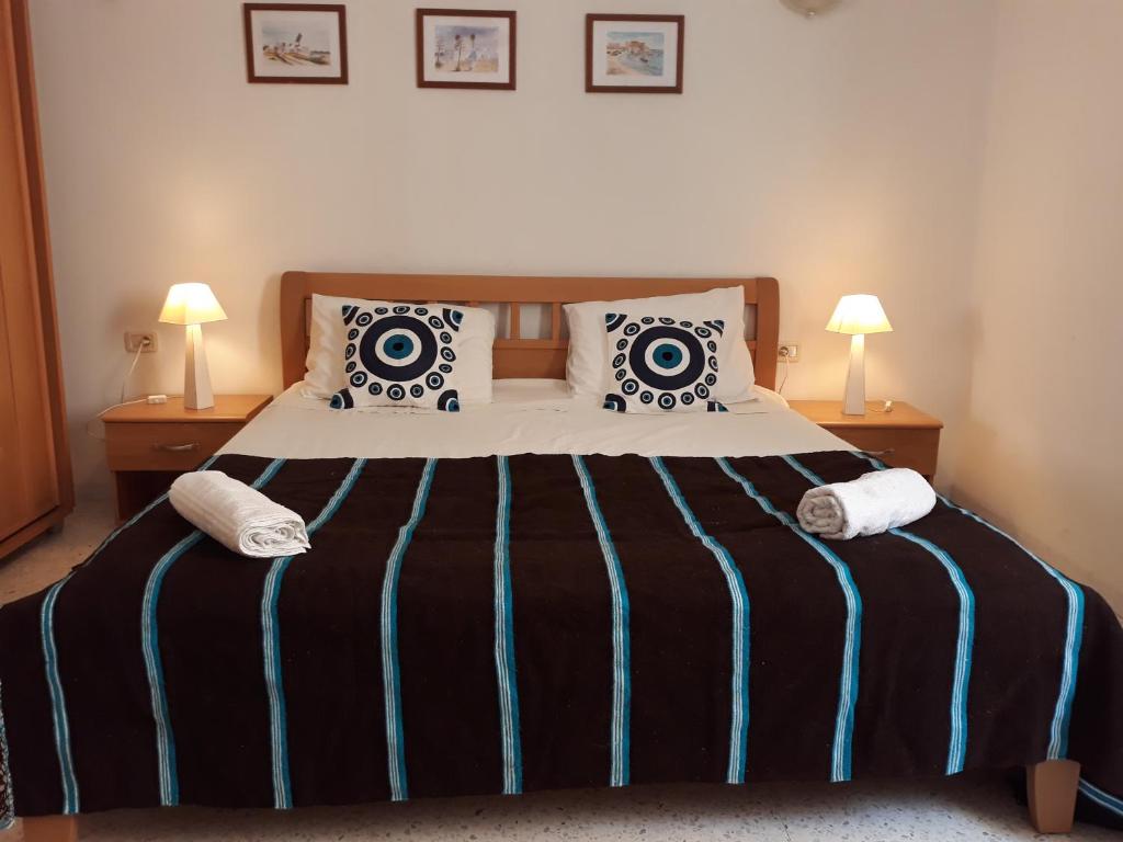 מיטה או מיטות בחדר ב-Superbe Appartement bord de mer