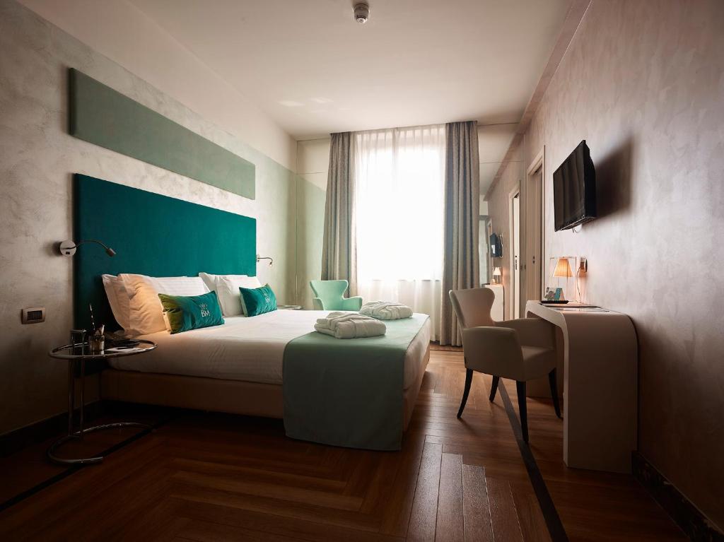 Postel nebo postele na pokoji v ubytování Bianca Maria Palace Hotel