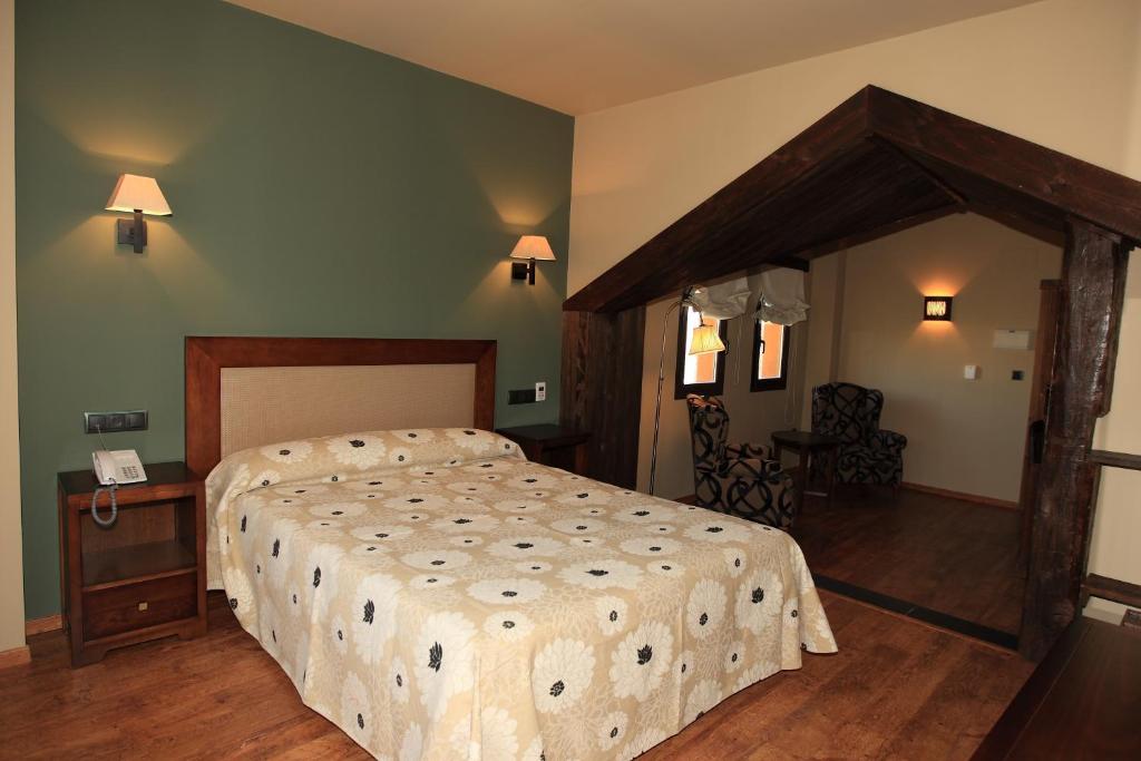 Postel nebo postele na pokoji v ubytování Hotel Zerbinetta