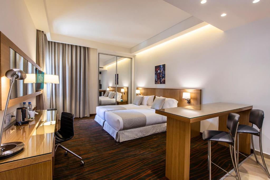 Postel nebo postele na pokoji v ubytování Citea Apart Hotel