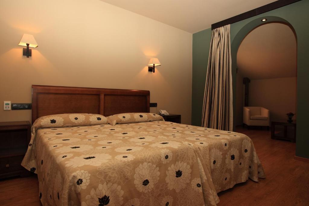 Postel nebo postele na pokoji v ubytování Hotel Zerbinetta