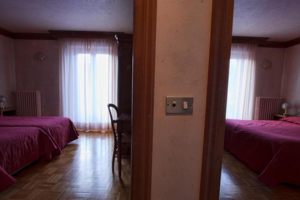 Кровать или кровати в номере Hotel Panoramique