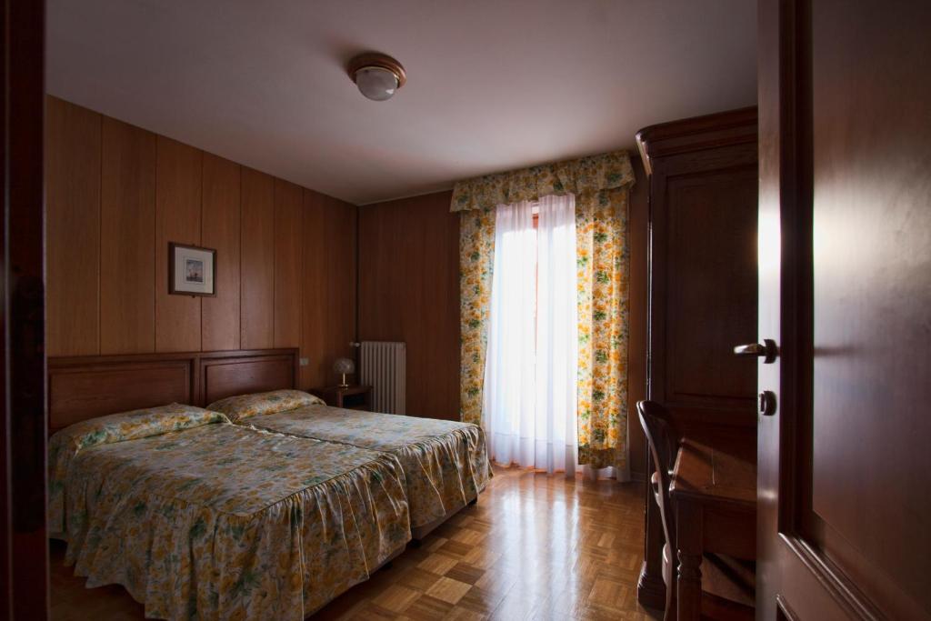 Кровать или кровати в номере Hotel Panoramique